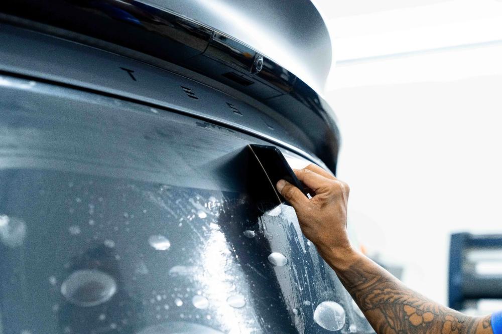 XPEL STEALTH matte film being applied to a green Corvette at Detailers of Fort Myers